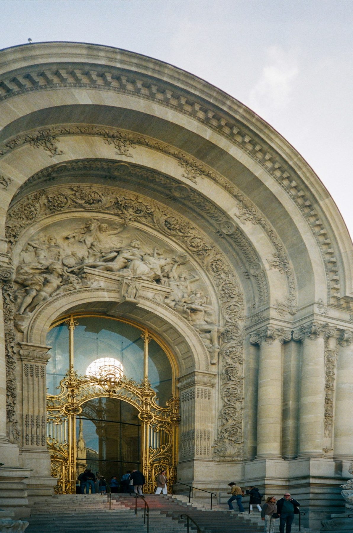 The carved stone arch and gilded gates of the Petit Palais