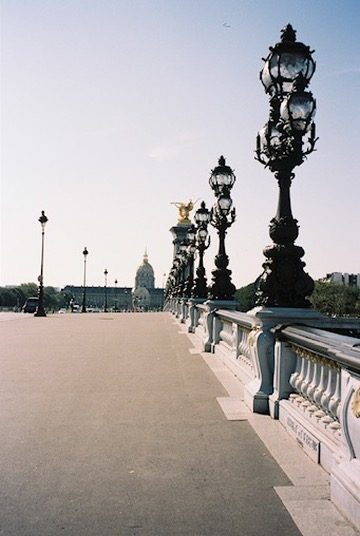 Ornate lamps along the Pont Alexandre III toward Les Invalides