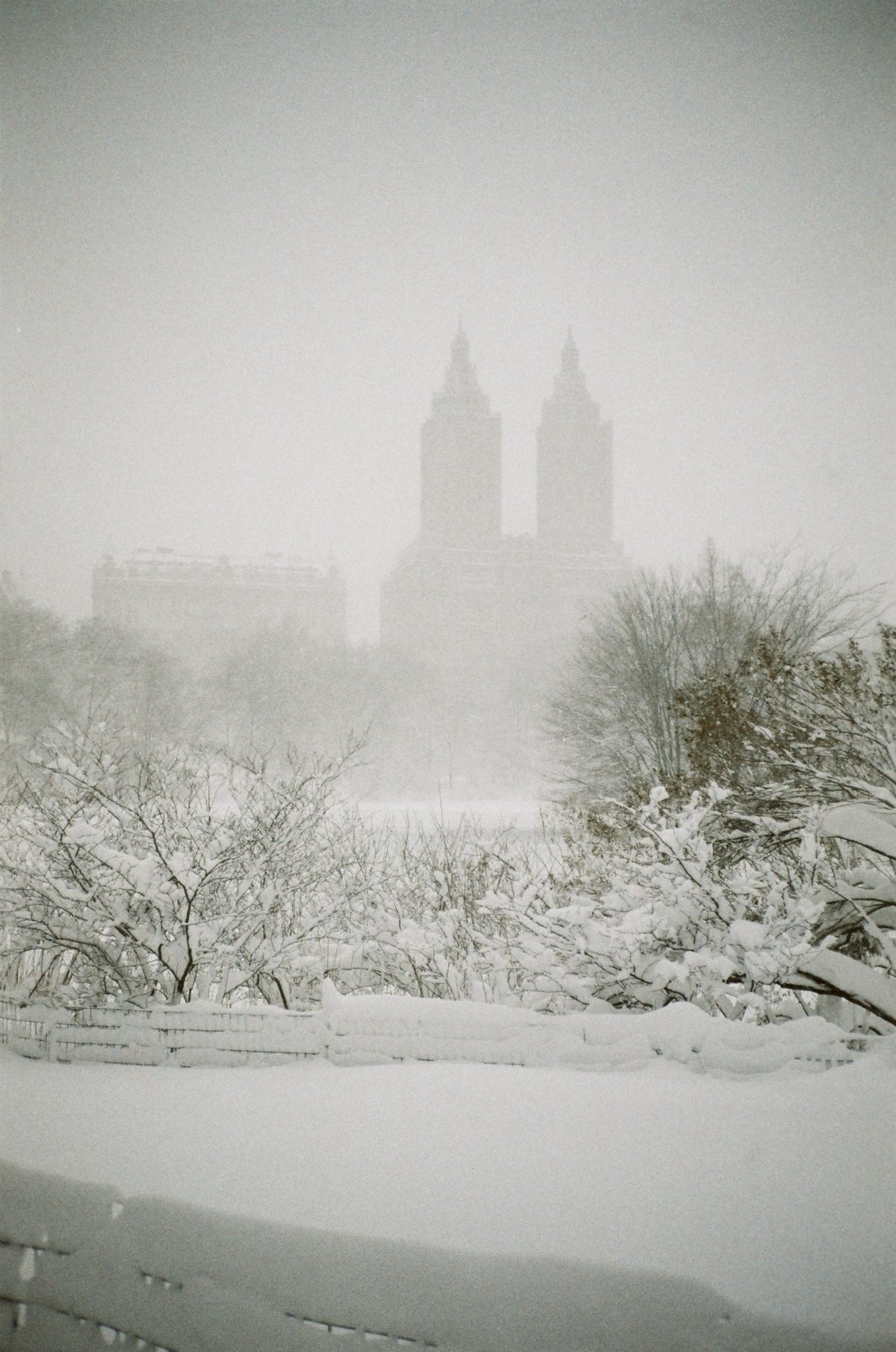 The twin towers of the San Remo fading into a snowstorm