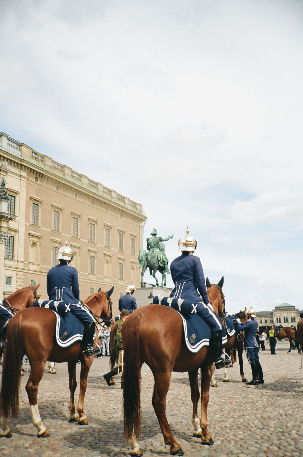 Mounted royal guards in blue with silver helmets outside the Royal Palace