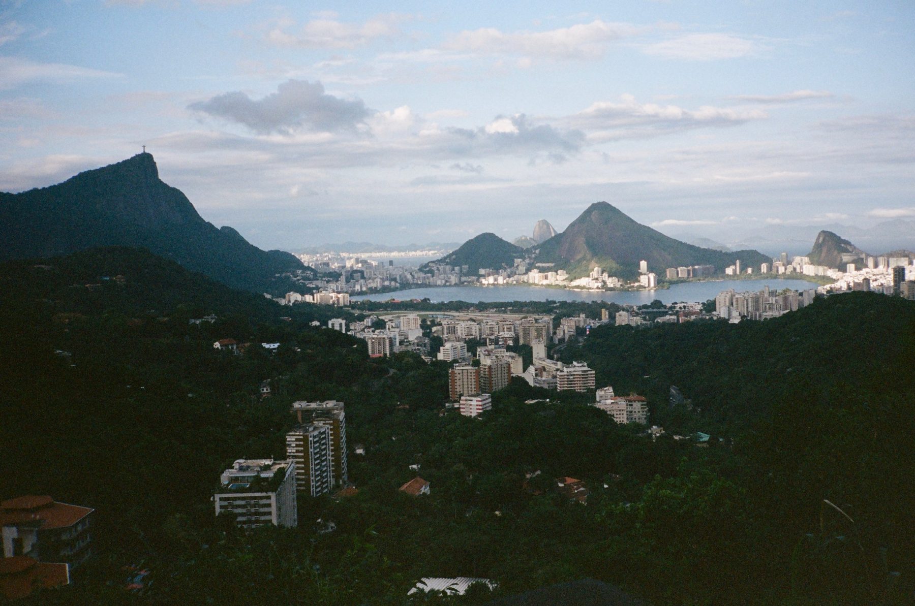 Rio from the hills: the lagoon, Sugarloaf and Christ the Redeemer under soft cloud