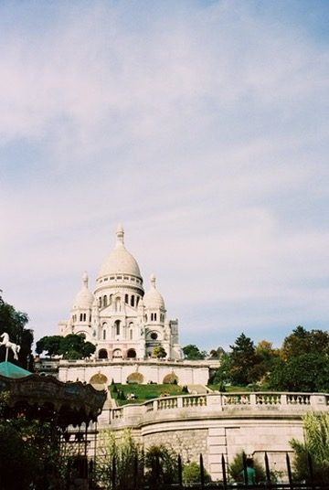 Sacré-Cœur above its gardens and a carousel