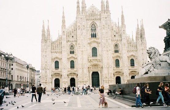 Piazza del Duomo in Milan with pigeons and passersby