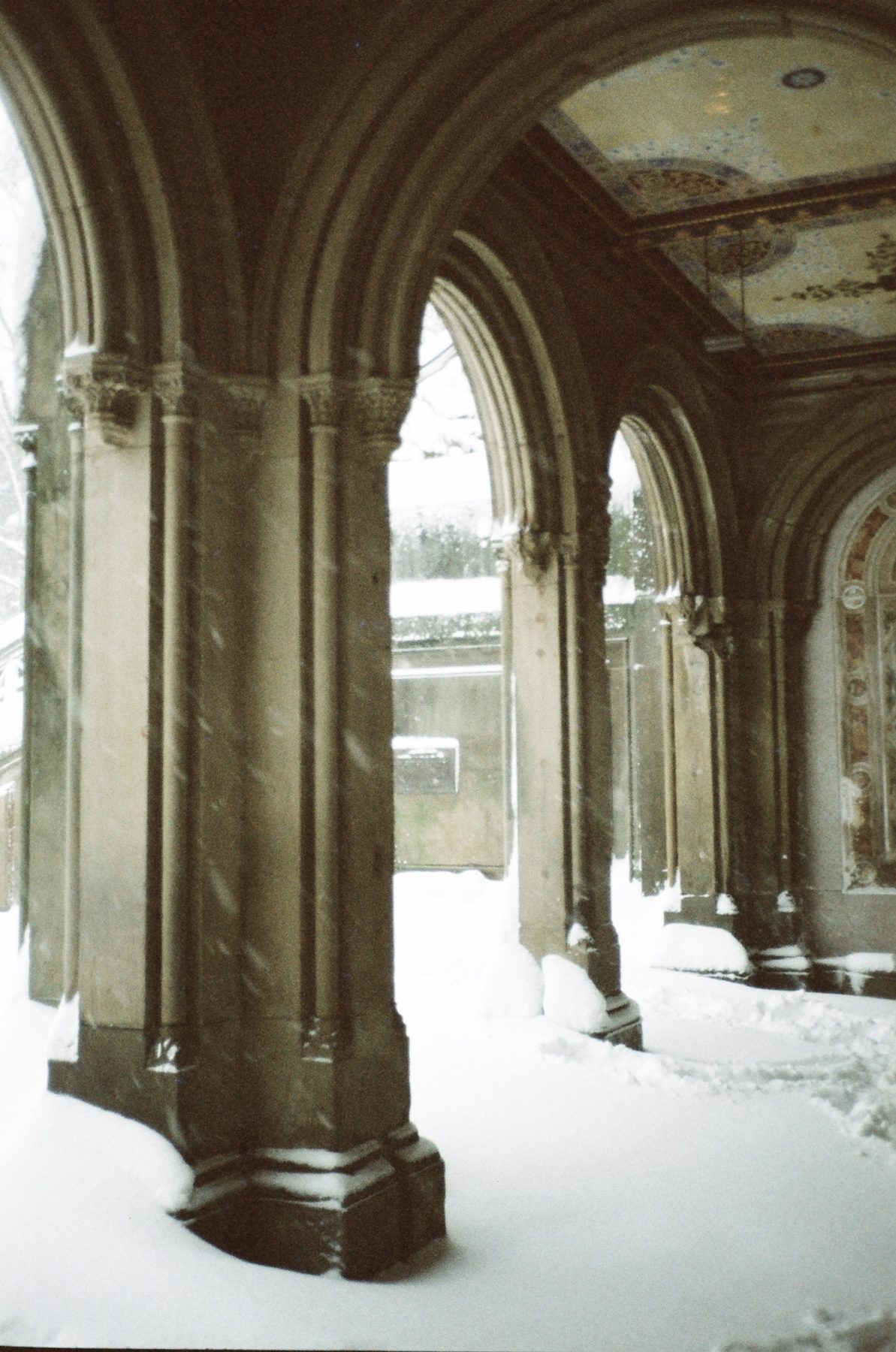 Snow drifting into the arches of the Bethesda Terrace arcade